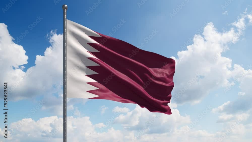 Qatar Flag Waving Slow Motion with the beautiful clouds in the background. Large Qatar Flag flies. National Day Celebration - Labor, Independence,  Memorial, Veterans, Patriots, President Day
