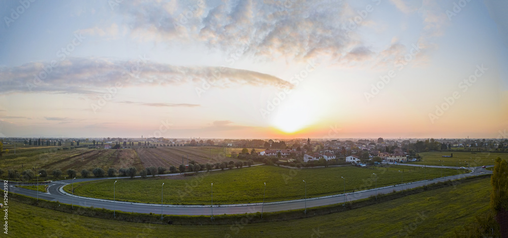 Panoramic view of a beautiful sunset on a little village near Pisa
