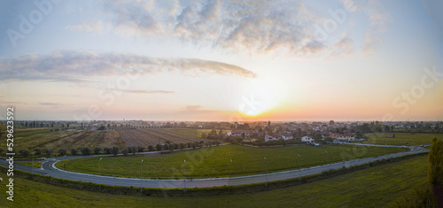Panoramic view of a beautiful sunset on a little village near Pisa