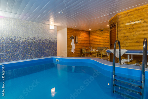 The original room of the SPA center with a large swimming pool, a wooden sauna and a relaxation area. © alhim