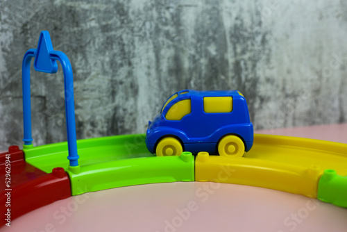 Fototapeta Naklejka Na Ścianę i Meble -  Multi-colored plastic constructor track with cars for children
