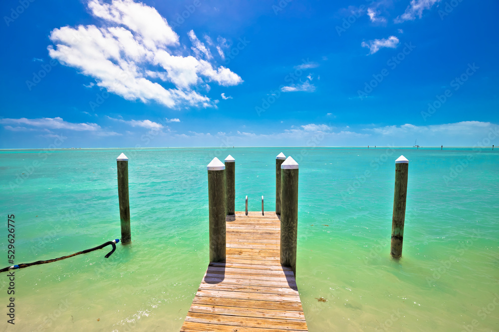 Idyllic turquoise bay and wooden dock in Islamorada on Florida Keys Idyllic turquoise bay and wooden dock in Islamorada on Florida Keys