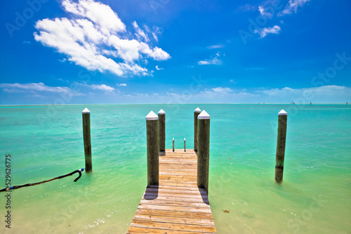Idyllic turquoise bay and wooden dock in Islamorada on Florida Keys © xbrchx