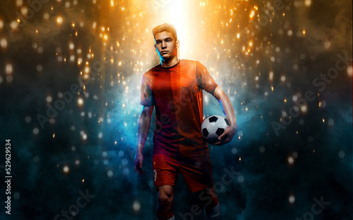 Football player. Teenager - soccer player. Boy in football sportswear after game with ball. Sport concept.