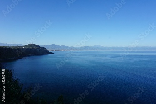 View of a glimpse of Sicilian coast and the Etna Volcano. Sicily , Italy