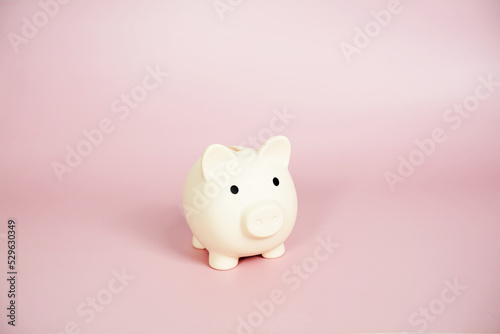 Piggy banks saving with space copy on pink background