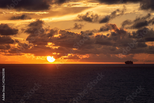 Beautiful, golden sunset over the calm ocean. © Mariusz