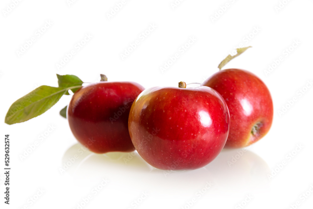 Three fresh red apples isolated on a white background
