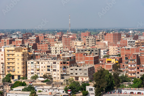 Fényképezés Buildings, cityscape, of Port Said, view from Suez Canal transiting cargo ship