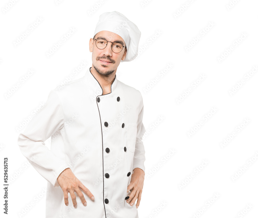 Friendly young chef doing a gesture of admiration Friendly young chef doing a gesture of admiration