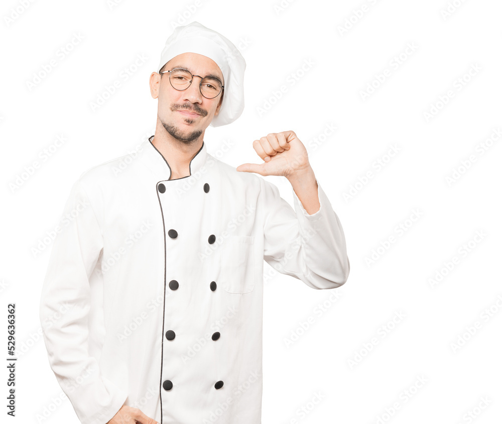 Proud young chef making a haughty gesture Proud young chef making a haughty gesture
