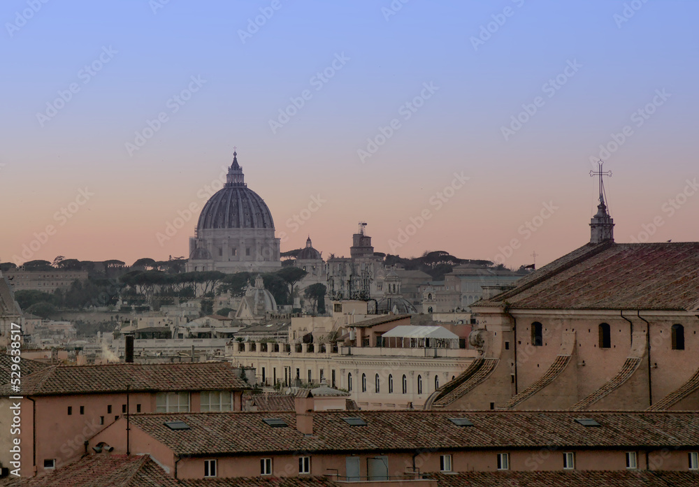 A view on Rome skyline, Golden hour at Piazza Venezia. beautiful domes, basilicas, cathedrals, and colorful rooftops