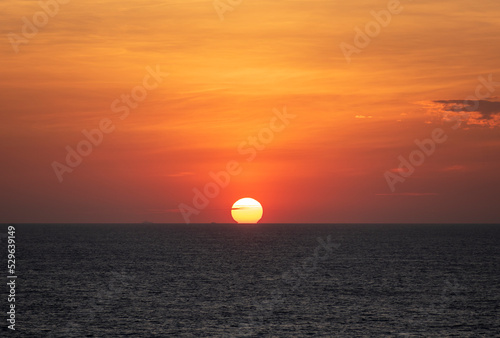 Beautiful, golden sunset over the calm ocean.