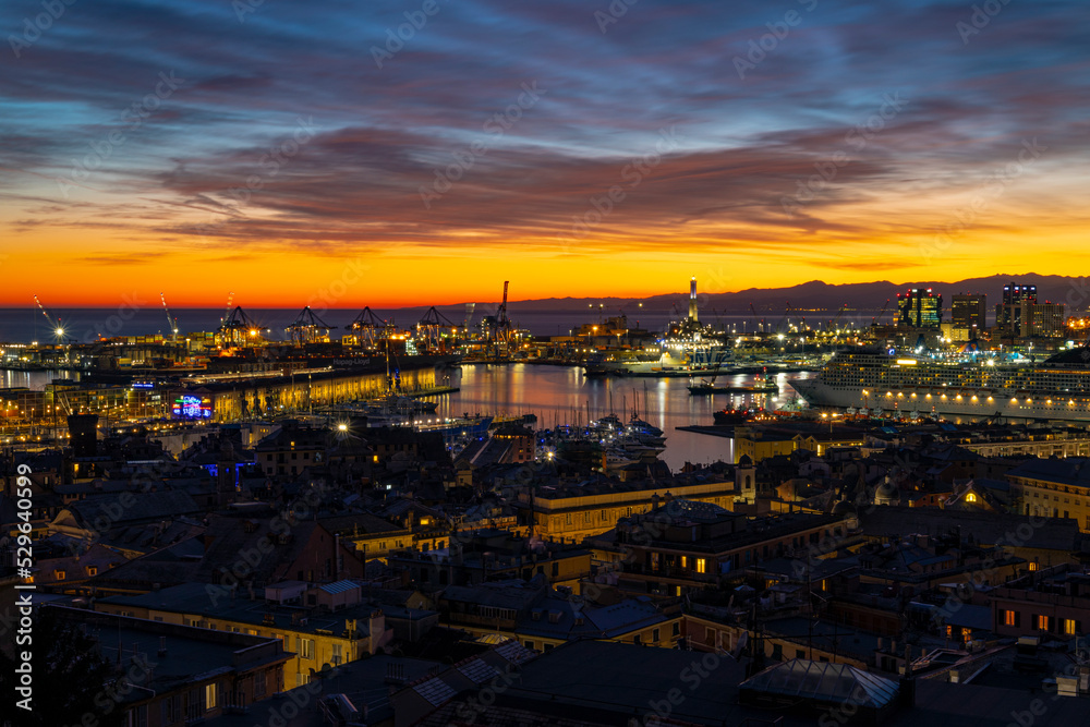 Obraz premium GENOA, ITALY, JANUARY 28, 2022 - View of the port of Genoa at sunset, Italy.