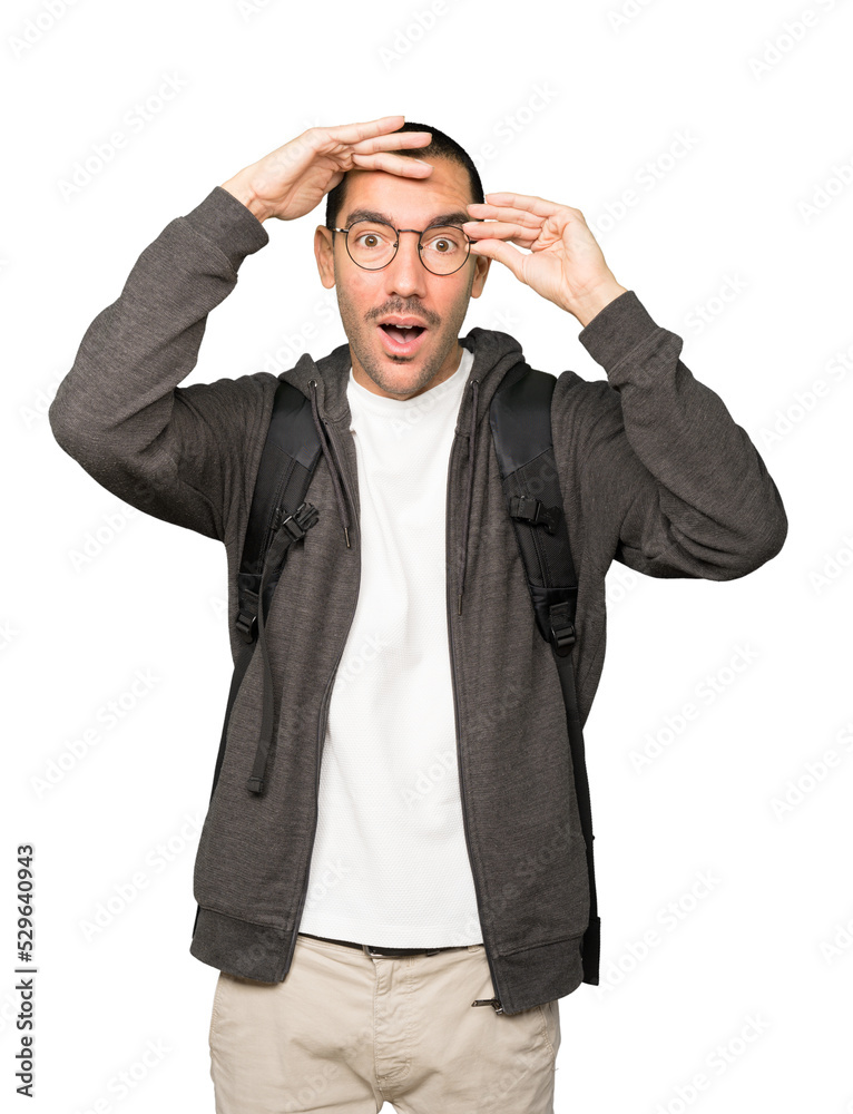 Astonished student with a gesture of looking away Astonished student with a gesture of looking away