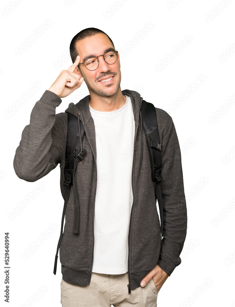 Happy student doing a gesture of concentration Happy student doing a gesture of concentration