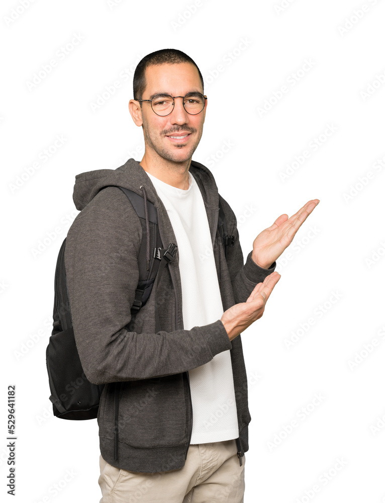 Friendly student making a gesture of welcome Friendly student making a gesture of welcome