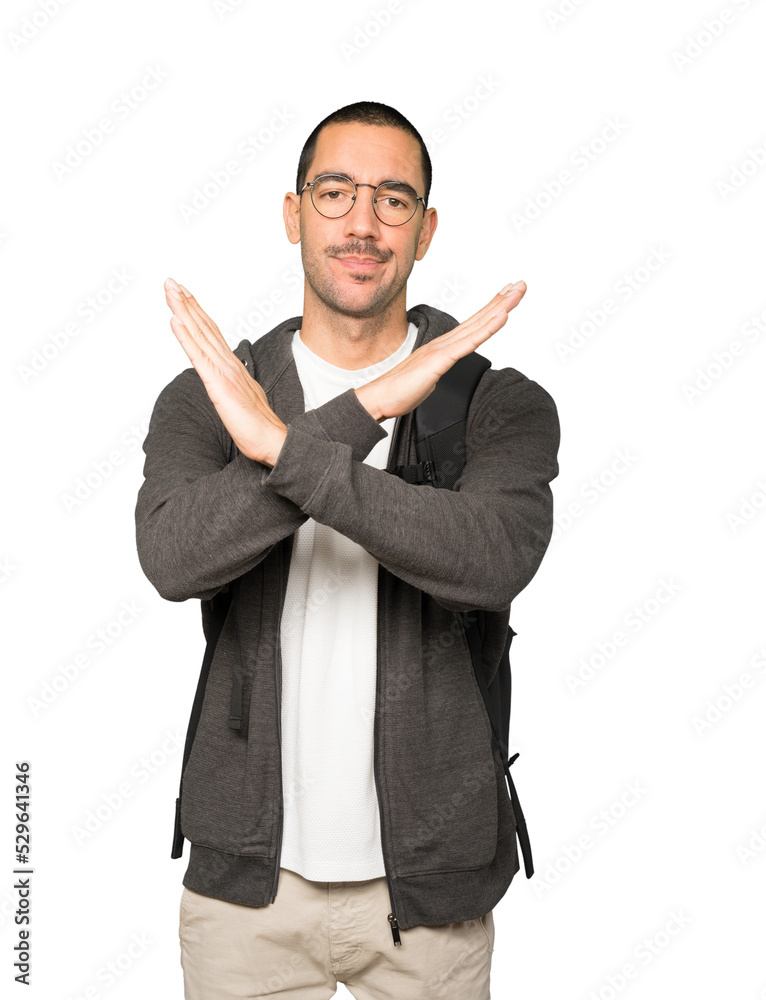 Student making a gesture of not crossing with the arms Student making a gesture of not crossing with the arms