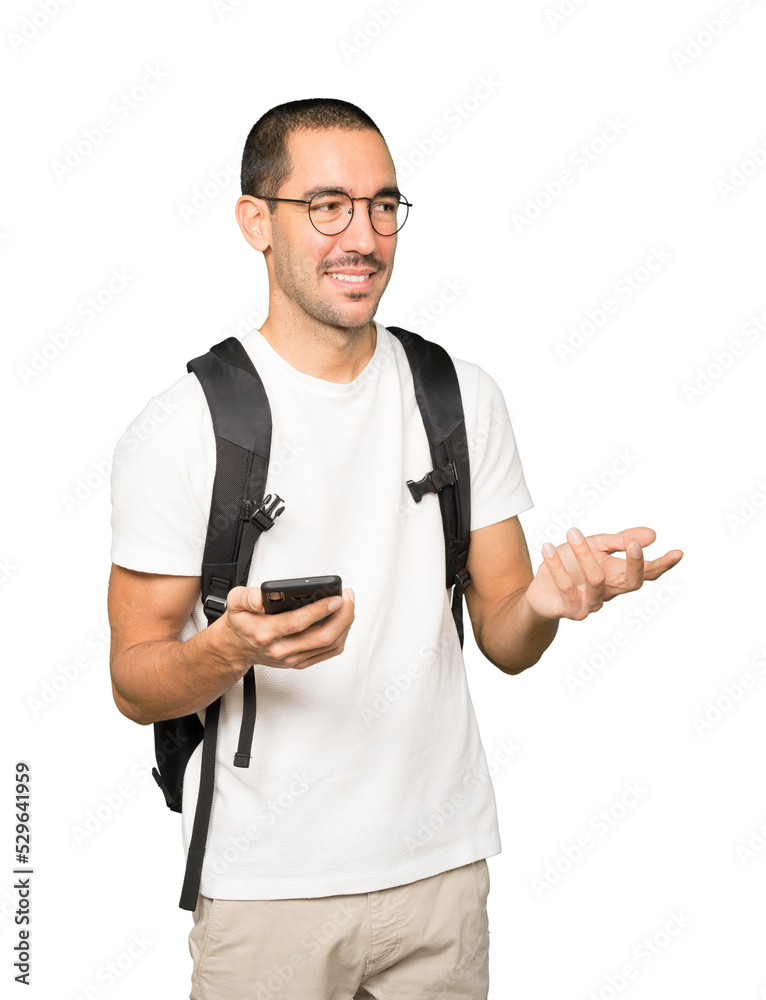 Happy student using his mobile phone Happy student using his mobile phone
