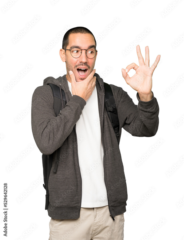 Surprised student with a gesture of approval Surprised student with a gesture of approval