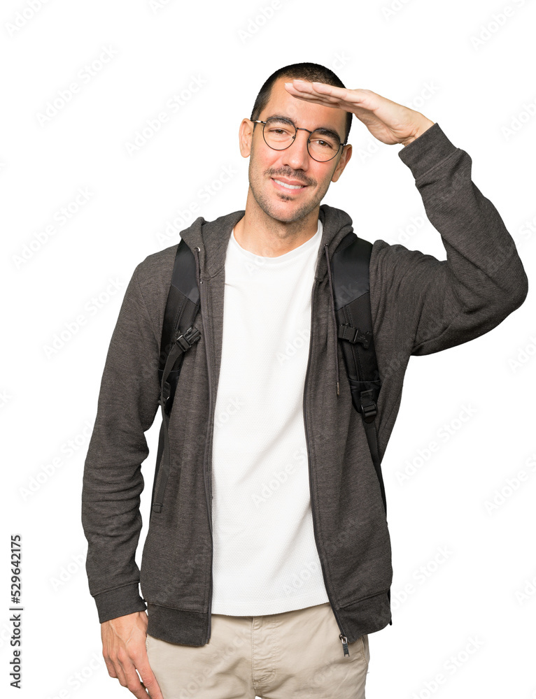 Fototapeta premium Happy student with a gesture of looking away