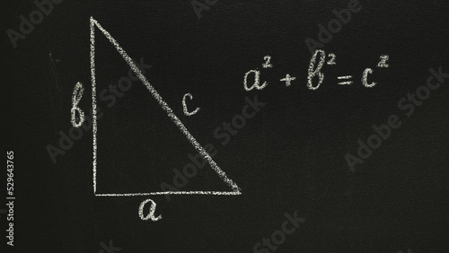 Photos Pythagorean theorem on a chalkboard. Handwritten letter