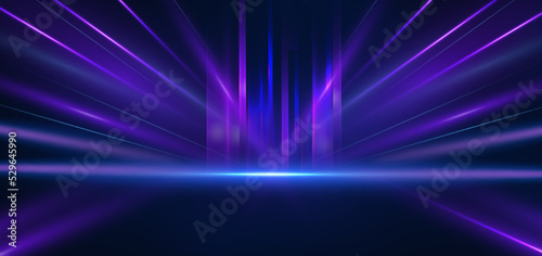 Abstract technology futuristic glowing blue and purple light lines with speed motion blur effect on dark blue background. © Pramote