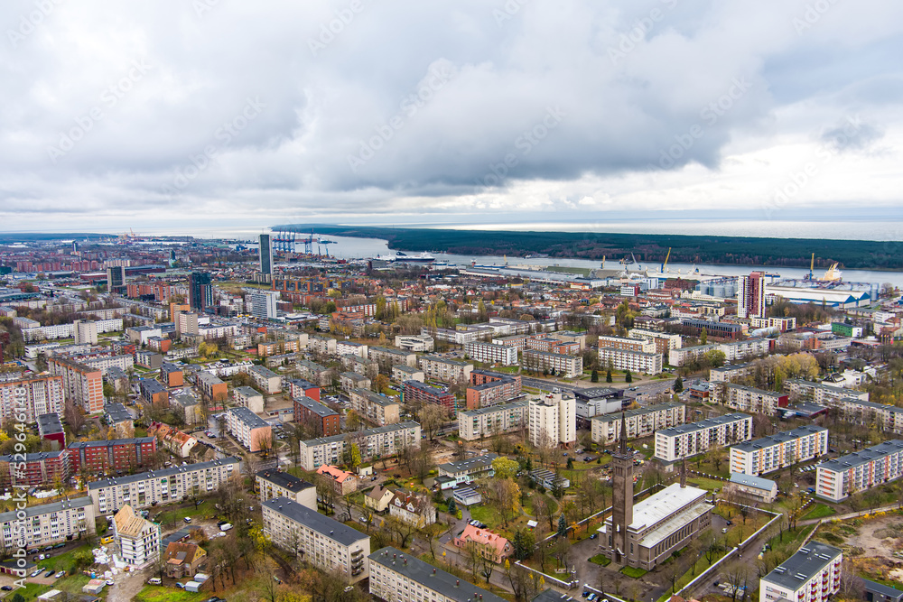 Aerial view of residential area of Klaipeda, Lithuania on cloudy evening. Klaipeda city port area and it's surroundings on autumn day.