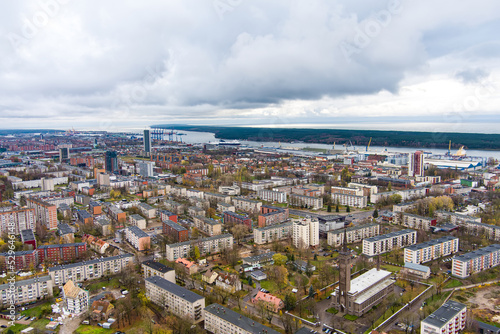 Aerial view of residential area of Klaipeda  Lithuania on cloudy evening. Klaipeda city port area and it s surroundings on autumn day.