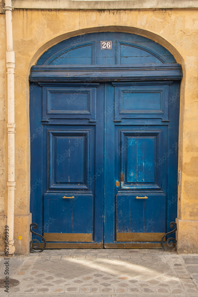 Paris, France. August 2022. Old entrance door to courtyard of building. Paris, France. August 2022. Old entrance door to courtyard of building.