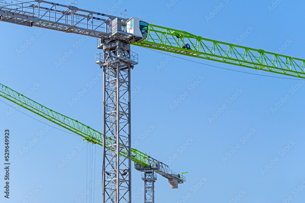 Freestanding tower cranes on a building site