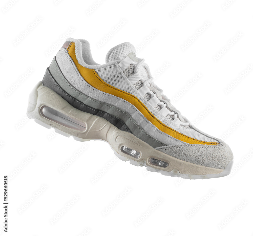 White sneaker with yellow accents on a transparent background, png, fashion, sport shoe,  air, sneakers, lifestyle, concept, product photo,  levitation concept, street wear, trainer - obrazy, fototapety, plakaty 