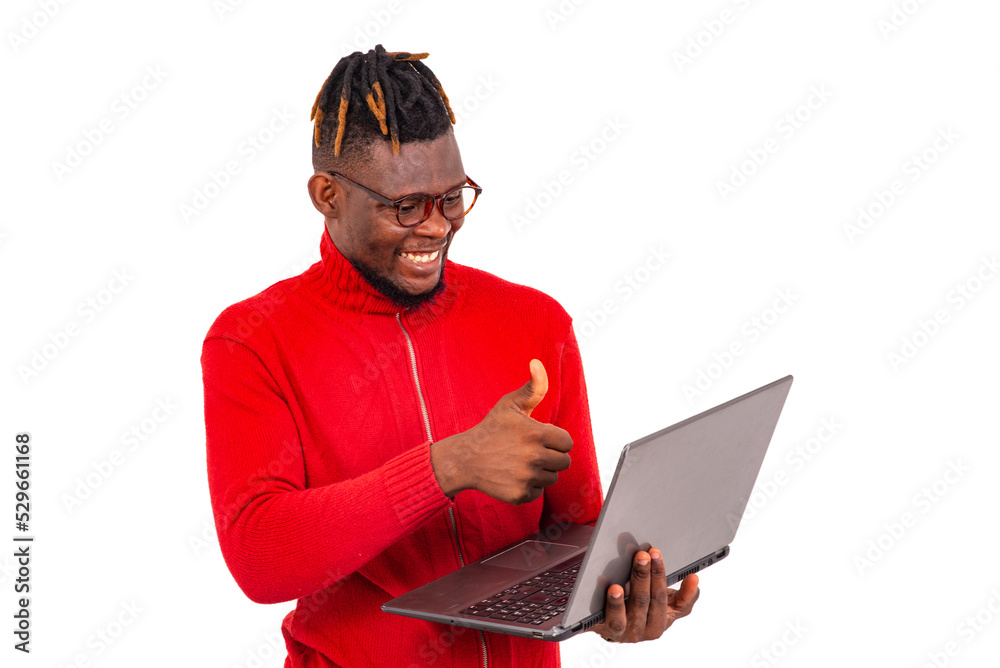 young man showing his thumb during a video call on a laptop. young man showing his thumb during a video call on a laptop.