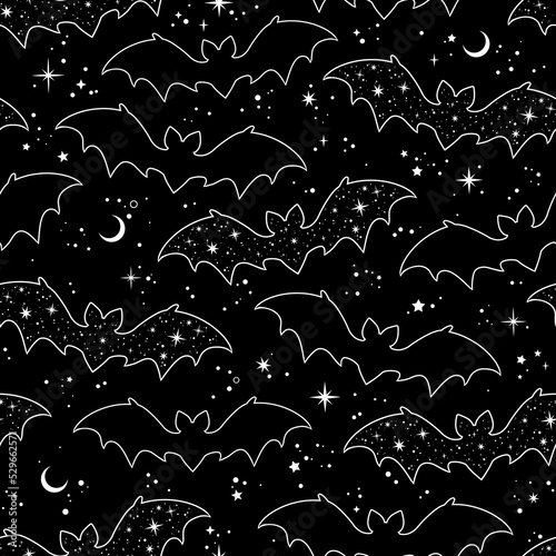 Silhouettes of cartoon bats on a black background. Seamless pattern