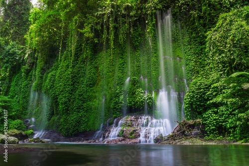 Indonesian scenery, waterfall area in beautiful tropical forest and clear water