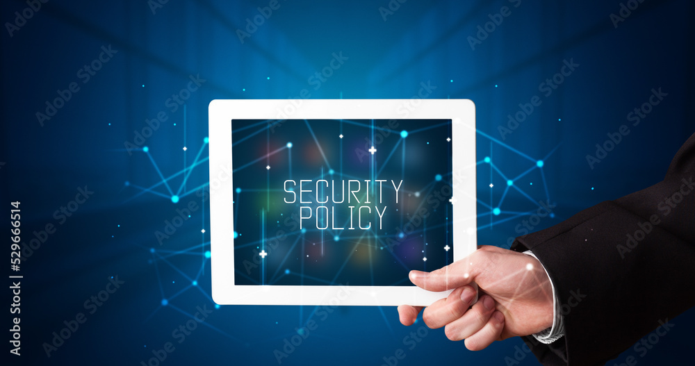 Person holding tablet, security concept Person holding tablet, security concept