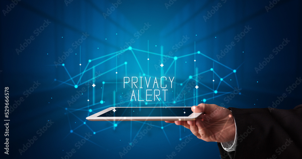 Person holding tablet, security concept Person holding tablet, security concept