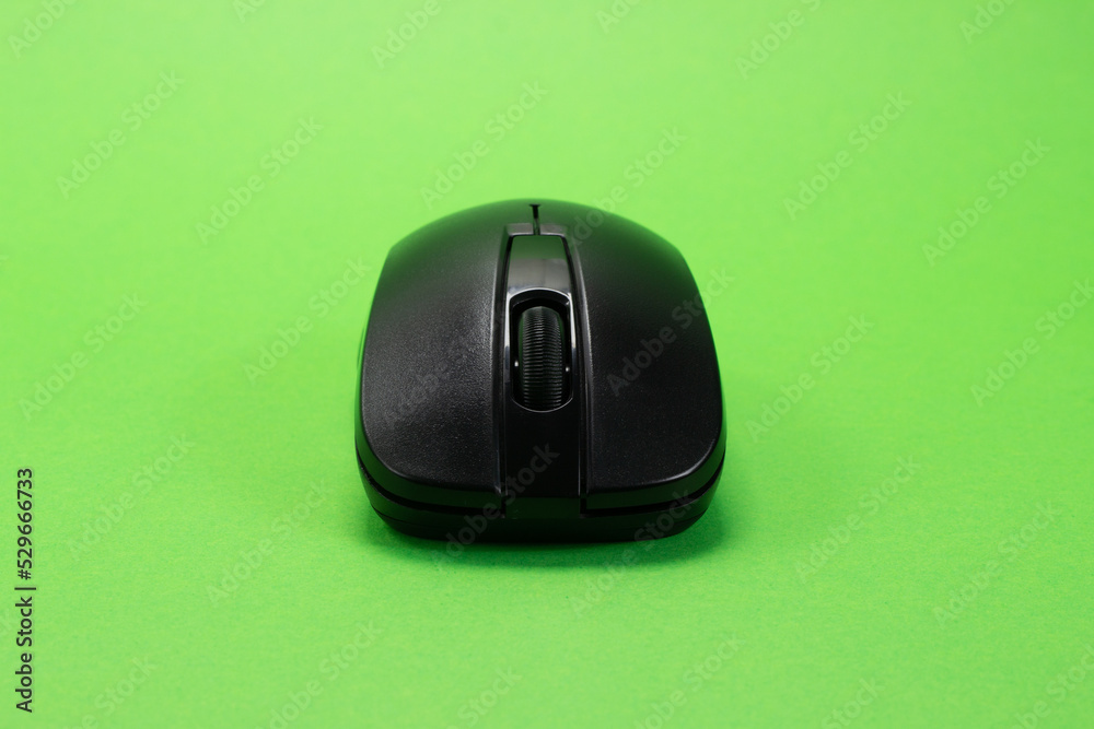 Wireless black mouse on a green isolated chroma key background Wireless black mouse on a green isolated chroma key background