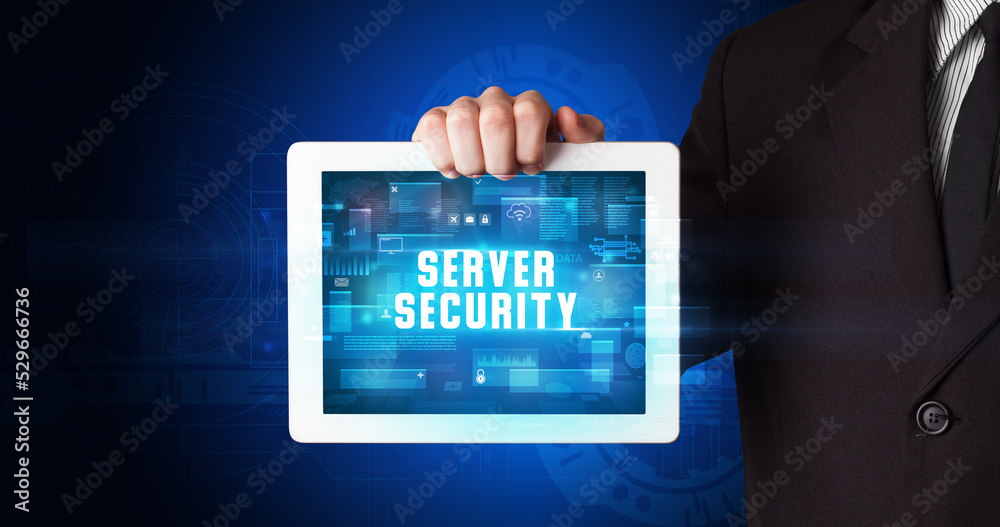 Person holding tablet, security concept Person holding tablet, security concept