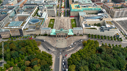 Aerial View of Brandenburg Gate (Brandenburger Tor) in Berlin, capital of Germany, Europe. From above of famous European city landmarks around neoclassical monument ft. touristic town center