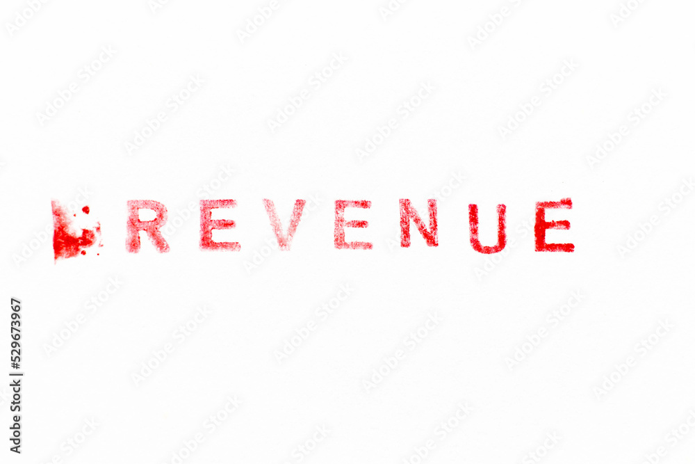 Fototapeta premium Red color ink rubber stamp in word revenue on white paper background