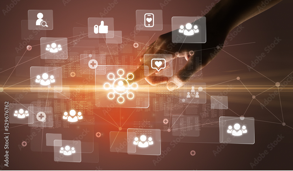 Hand pressing social media multimedia application screen with media icons on futuristic concept Hand pressing social media multimedia application screen with media icons on futuristic concept