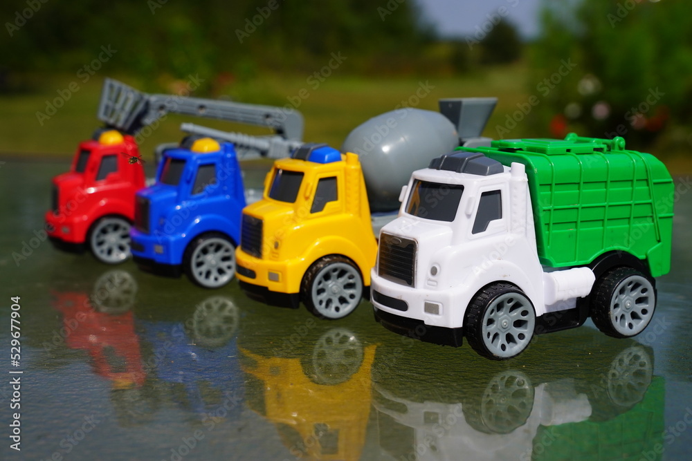 Young child's toy truck set sitting outside. Young child's toy truck set sitting outside.