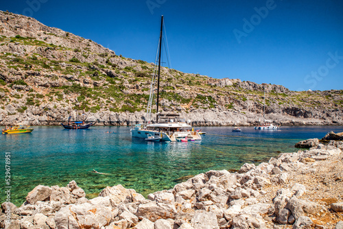 Fototapeta Naklejka Na Ścianę i Meble -  Luxurios yachts in Anthony Quinn bay in Rhodes island, Greece