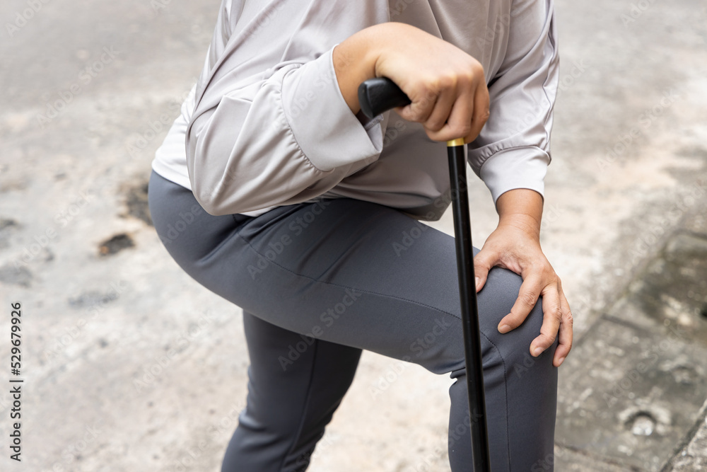 old senior woman with knee pain, osteoarthritis, osteoporosis using