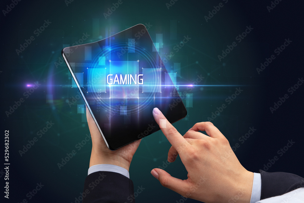Obraz premium Businessman holding a foldable smartphone