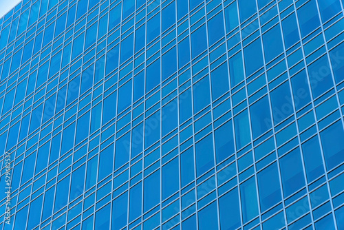 Blue building exterior with reflective glass facade in downtown Austin Texas