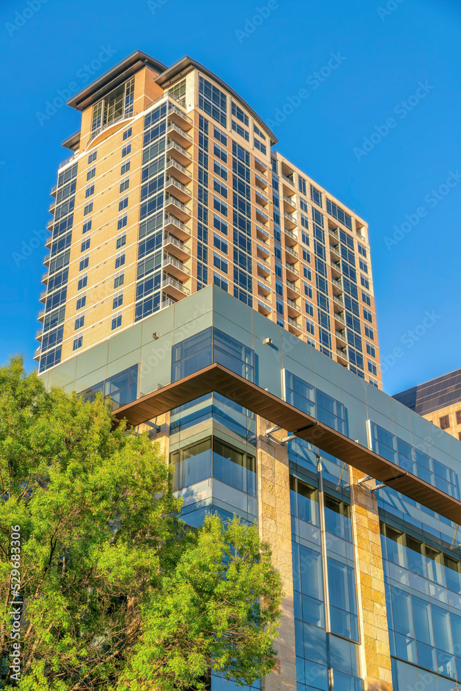 Exterior of luxury apartments in city residential area with blue sky background