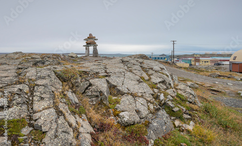 Inukshuk (Inuksuk) on hilltop at the entrance to Rankin Inlet on the Hudson Bay photo