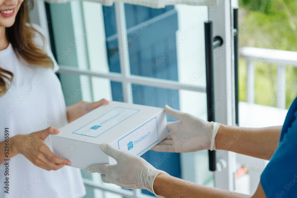 Obraz premium Close-up hand young asia woman pick up covid free first aid self recover health care give to help patient people buy online clinic retail Rx drugstore in telehealth telemedicine e-commerce home order.
